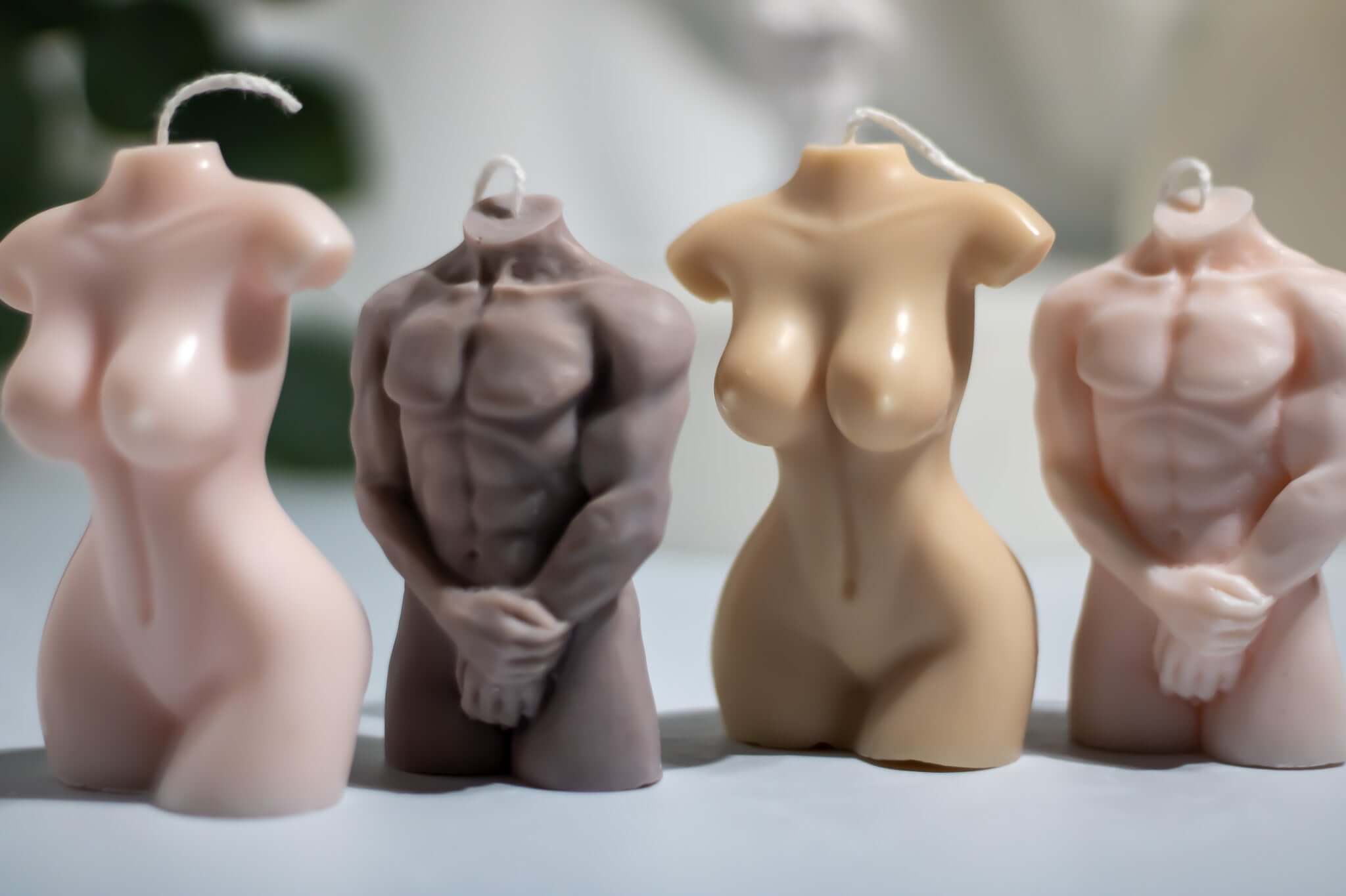 Artisan torso candle – hand-poured masculine sculpture in soft pastel wax