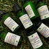 Votive essential oil bottles on grass