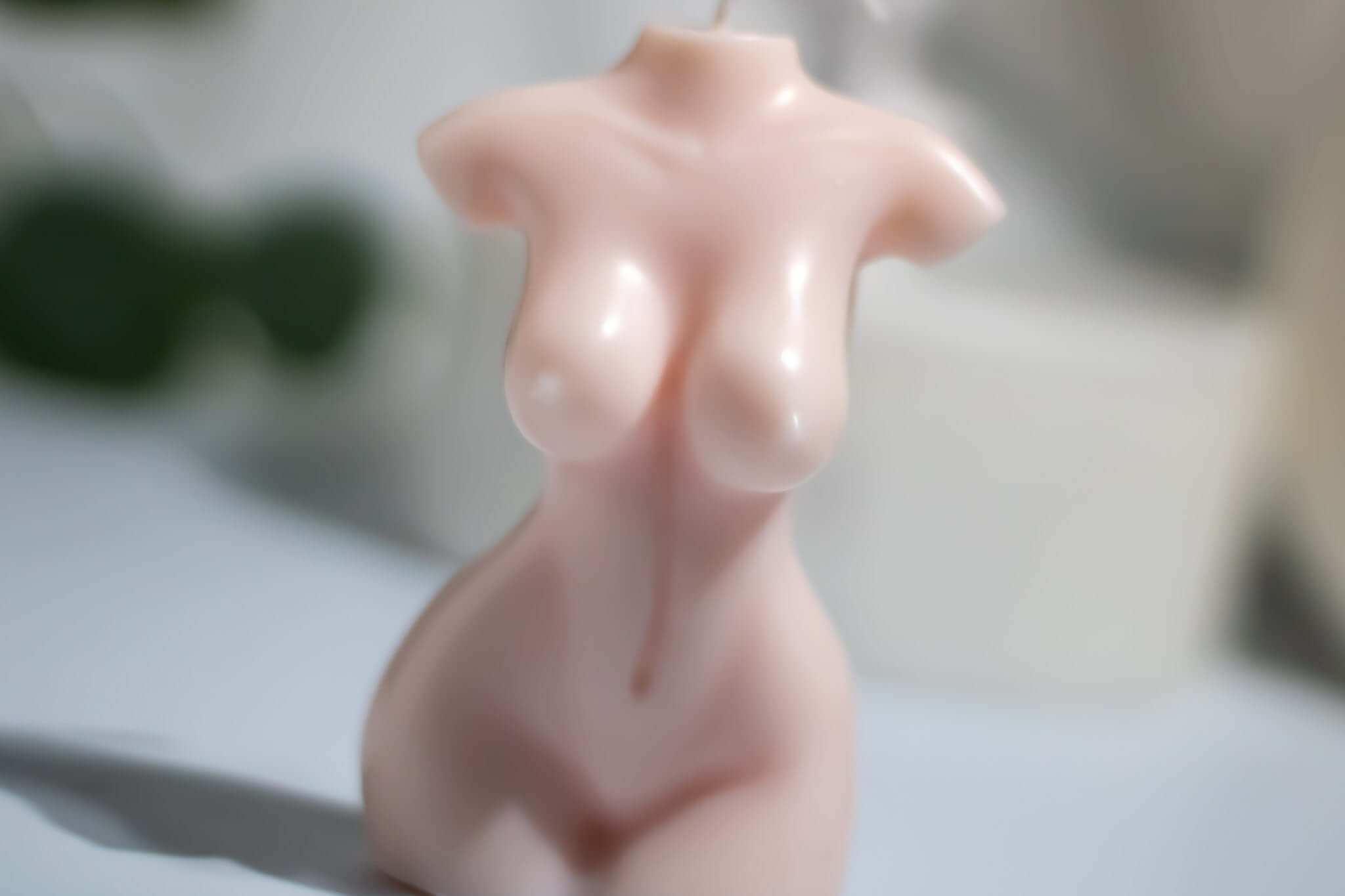 Nude body candle made of sculptural soy wax, elegant feminine form, handcrafted for home decor.