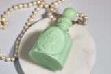 Perfume bottle sculpture candle – natural wax, artistic and gift-worthy.