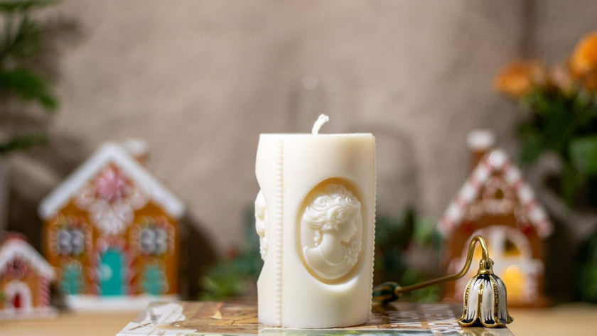 Handcrafted Camee Marie scented candle, featuring an elegant vintage cameo relief design, made from natural soy wax.
