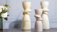 Close-up of the scented knot candle, showcasing its intricate twisted design and smooth, hand-poured wax finish.