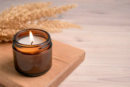 Therapeutic aromatherapy soy candle with essential oils creating a calming home atmosphere