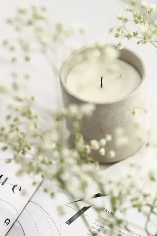 Natural soy wax candle burning in a wellness-inspired home