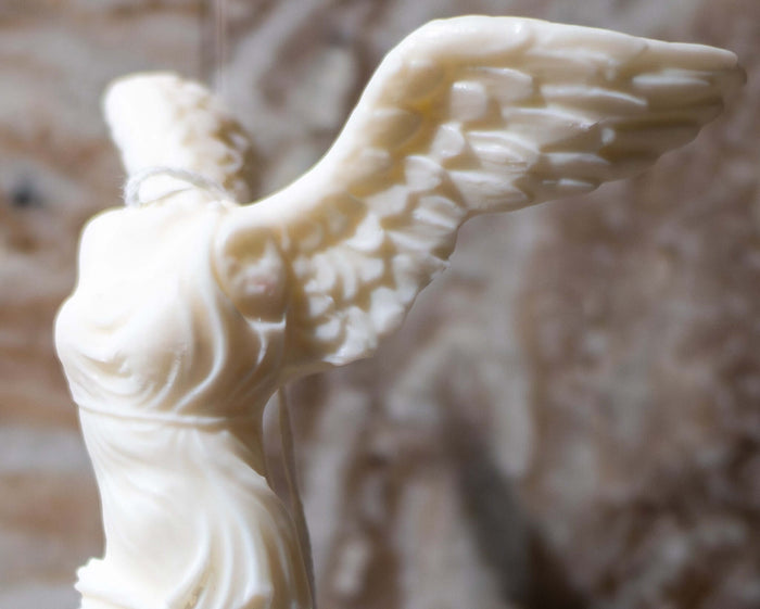 Winged Victory candle — soy wax sculpture of the Nike of Samothrace, handmade by Votive Candle Co.
