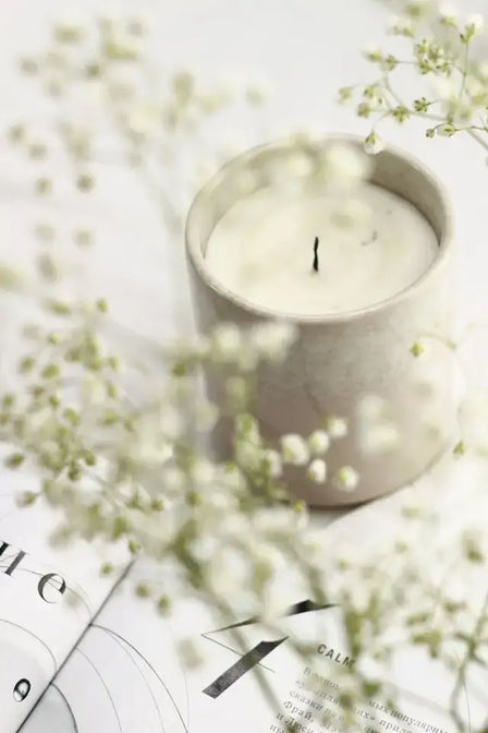 Natural soy wax candle burning in a wellness-inspired home