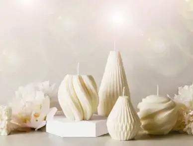 White twisted, pear-shaped and swirl candles with white flowers