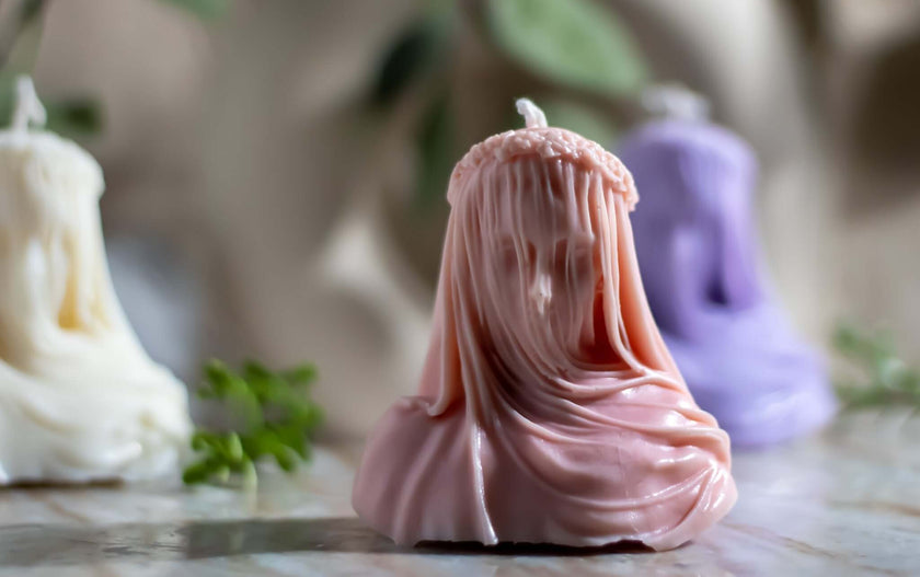 Artistic soy wax candle inspired by the veiled woman sculpture – a luxurious blend of scent and form.