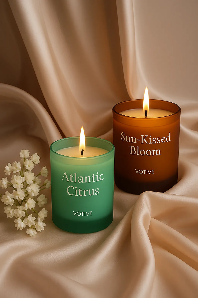 Two natural soy candles, Atlantic Citrus with sweet orange, Sicilian bergamot, and lavender oils, and Sun-Kissed Bloom floral blend, hand-poured for eco-friendly aromatherapy and elegant home décor.