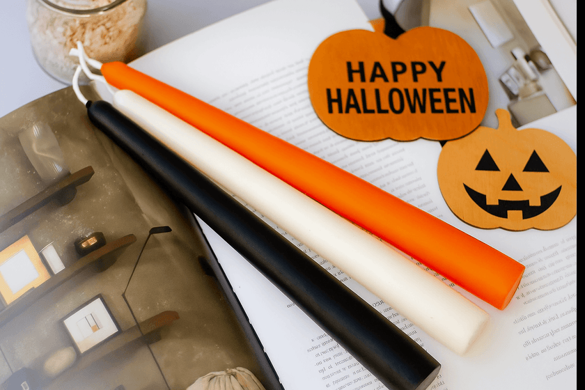 Autumn orange taper candles for seasonal table settings.