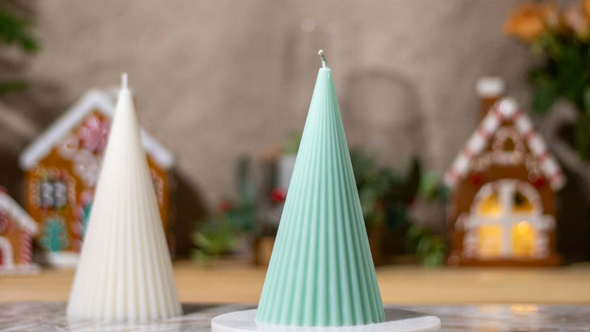 Handcrafted Christmas tree decorative candles in mint green and white, perfect for holiday gifting and festive decor.