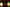 Three textured Christmas ornaments with green ribbons against a blurred festive background.