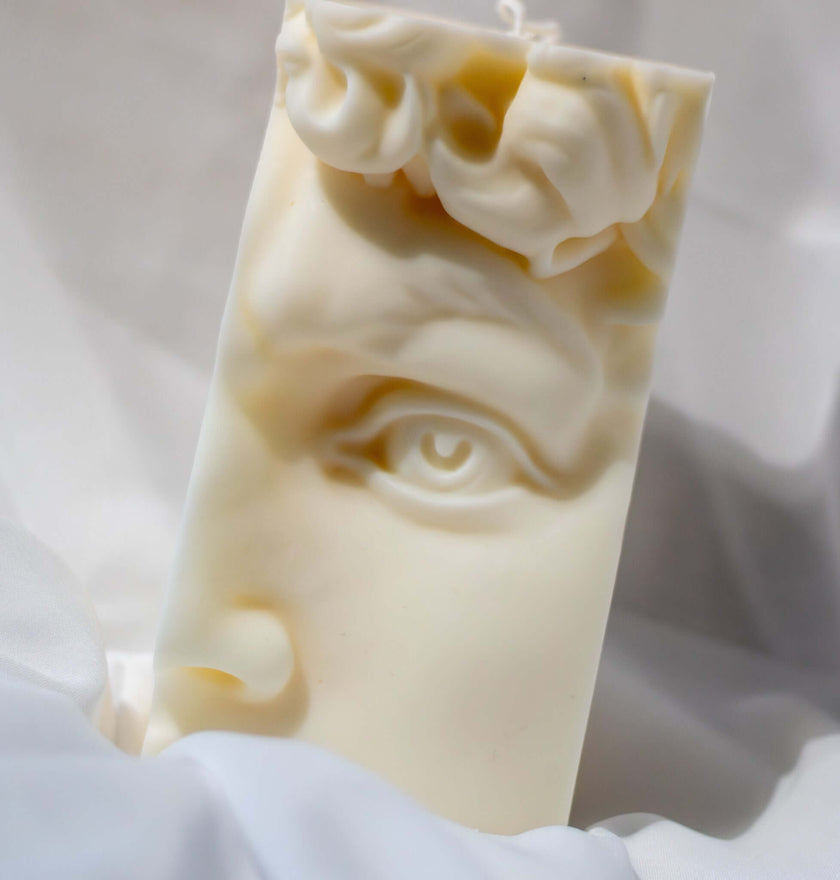 Close-up of the David Face candle, showcasing intricate facial details and a smooth, artistic wax finish.