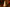 Decorative candle shaped like a Christmas tree on a gold plate with festive background
