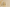 Two decorative candles on a surface with a neutral background