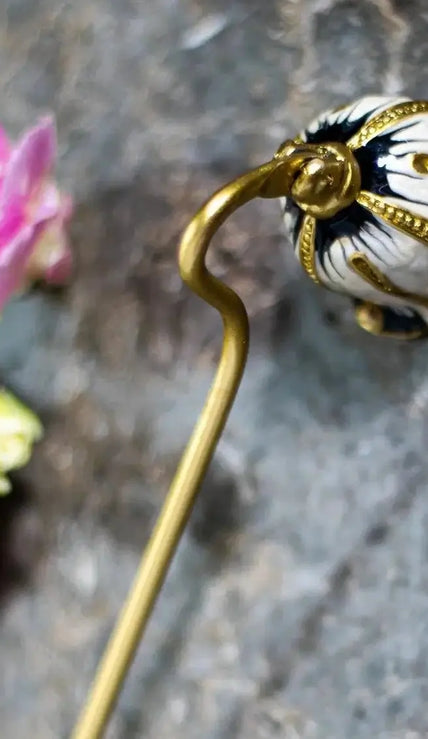 Elegant flower-shaped candle wick snuffer – premium quality design.