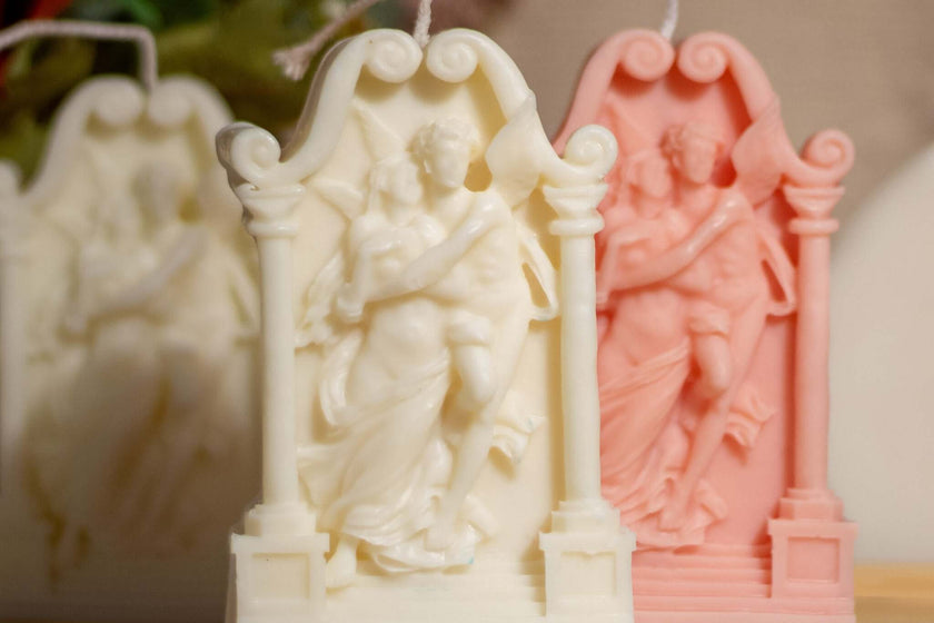 Decorative soy wax sculptures in pink and white, featuring romantic lovers design, ideal for home decor or gifts.