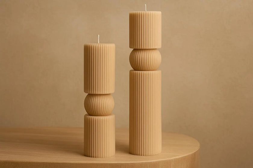  beige textured candles set of two on a wooden surface with a beige background