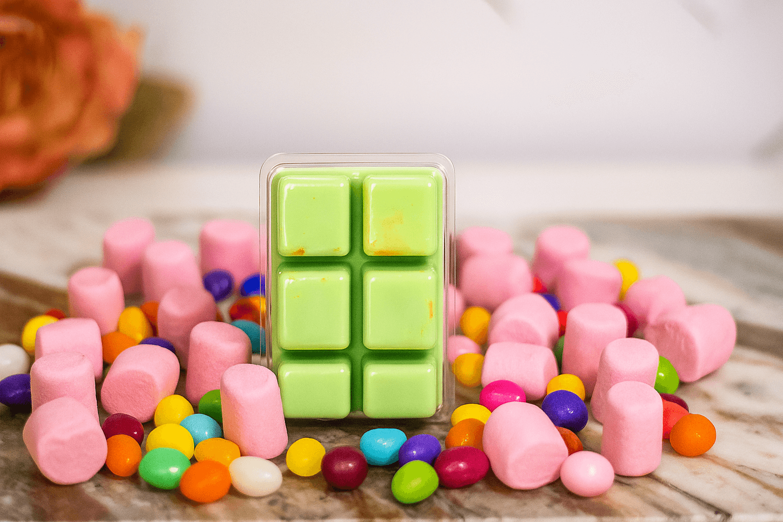 Green soy wax melts in candy-inspired photo setup, non-GMO wax, safe fragrance, hand-poured for sweet and playful home scenting.
