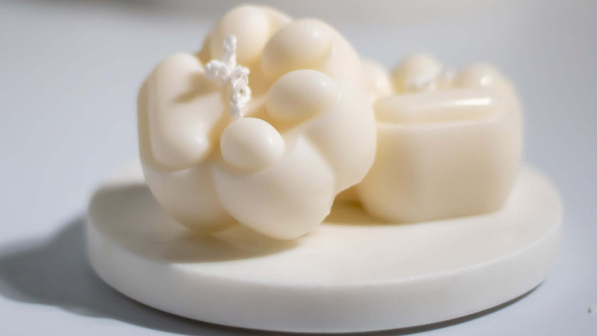 Hand-poured non-toxic soy wax candle with an adorable paw print design.