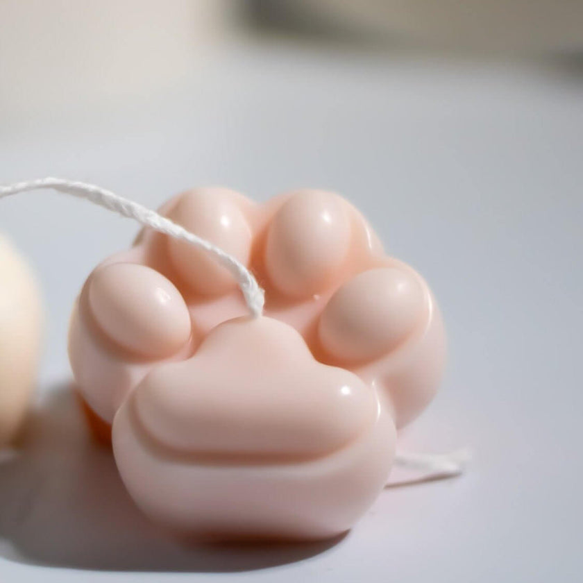 Handcrafted Special Paws non-toxic candle with paw print design.