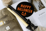 Handmade Halloween taper candles in white, natural soy wax.