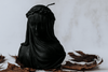 Handmade black soy wax Halloween candle with intricate veiled woman design for gothic home décor


