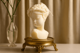 Little Girl scented candle displayed on a wooden tray, adding a whimsical and cozy ambiance to any space.