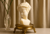 Little Girl scented candle displayed on a wooden tray, adding a whimsical and cozy ambiance to any space.