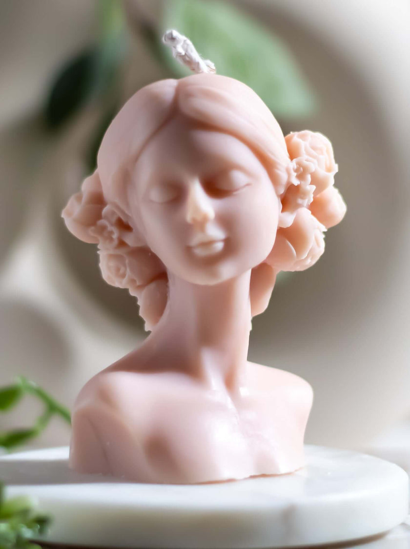 Small Woman Bust Natural Candle Dayanara with floral details and soft pink finish.