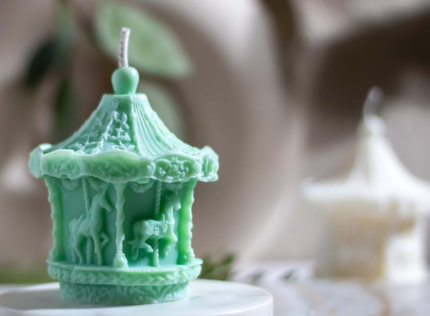 Close-up of a decorative candle carousel, featuring a rotating design powered by candle heat for a cozy Christmas effect.