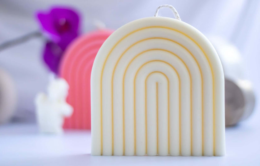 Artisan Big Arch natural scented candle featuring a unique rainbow design, perfect for elegant home decor.