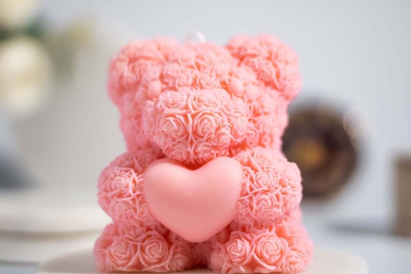 Pink flower bear candle with heart-shaped feature, perfect gift for her and decorative accent.