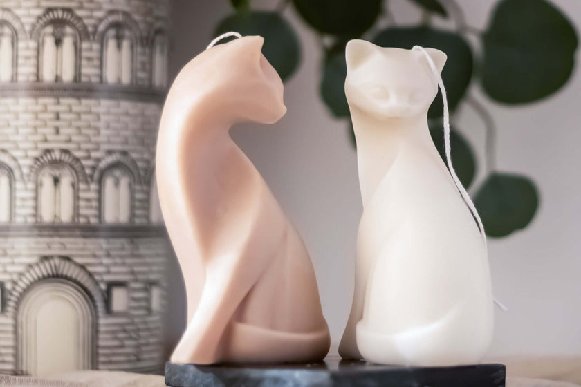 Handcrafted Cat Lady sculptural candle, featuring an elegant feminine figure embracing a cat, made from natural soy wax.