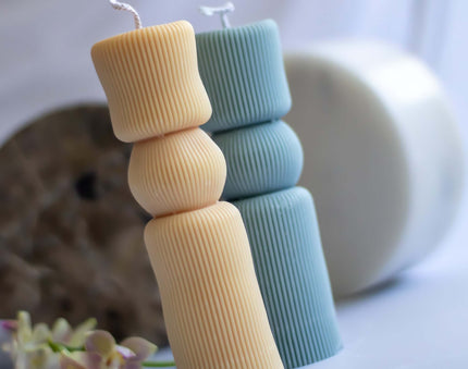 Close-up of the King’s Pillar candle, showcasing its intricate sculptural details and smooth, eco-friendly wax finish.