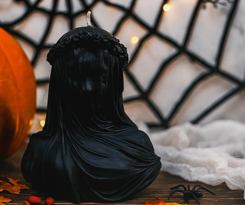 Luxury Halloween candle in black soy wax featuring detailed veiled lady sculpture for spooky interiors