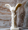 Luxury scented candles inspired by classical Greek sculpture.