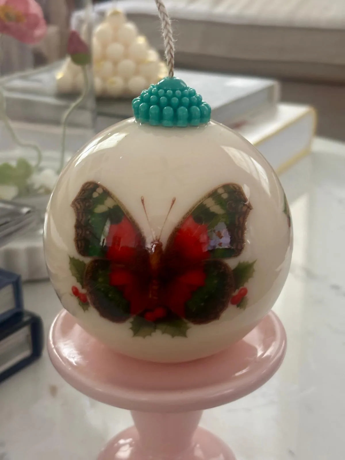 Minimalist holiday decor featuring an eco-conscious sculptural candle with artful surface design.