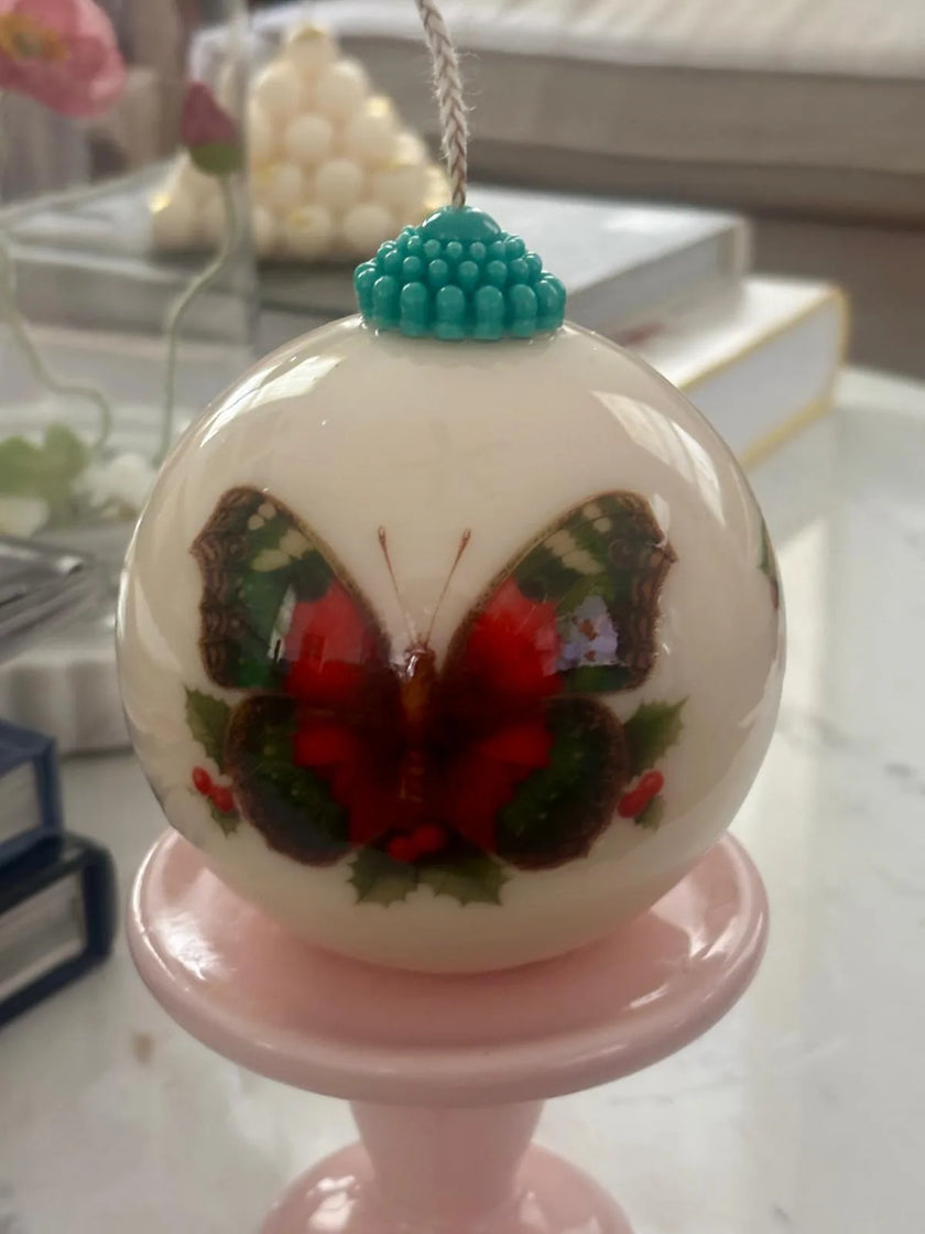 Minimalist holiday decor featuring an eco-conscious sculptural candle with artful surface design.