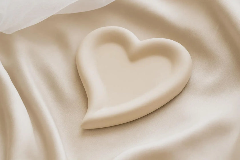 Heart-shaped object on a beige fabric background