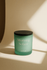 Morning ritual aromatherapy candle in green glass jar with uplifting citrus and vanilla scent – handcrafted for wellness