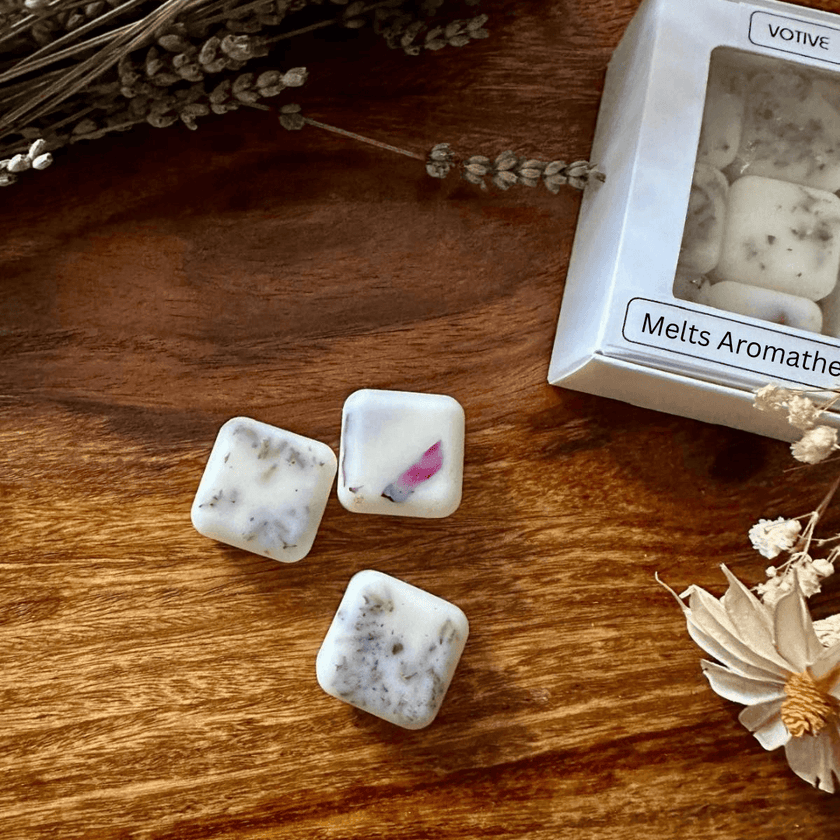 Natural wax melts for aromatherapy, featuring lavender, citrus, ylang-ylang, peppermint, vanilla, and sage blends