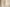 Set of two cylindrical candles on a small round table with a neutral background