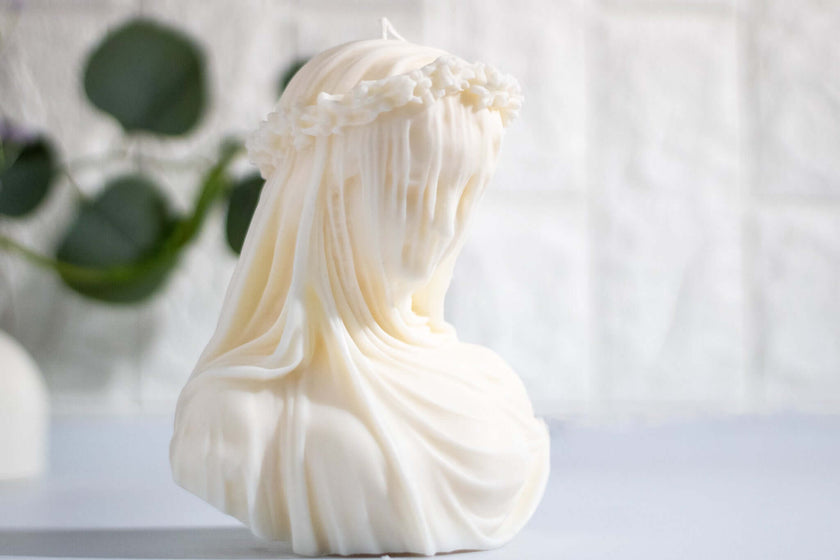 Sculpted soy candle of veiled woman – perfect as a gift or art object in serene interior spaces.