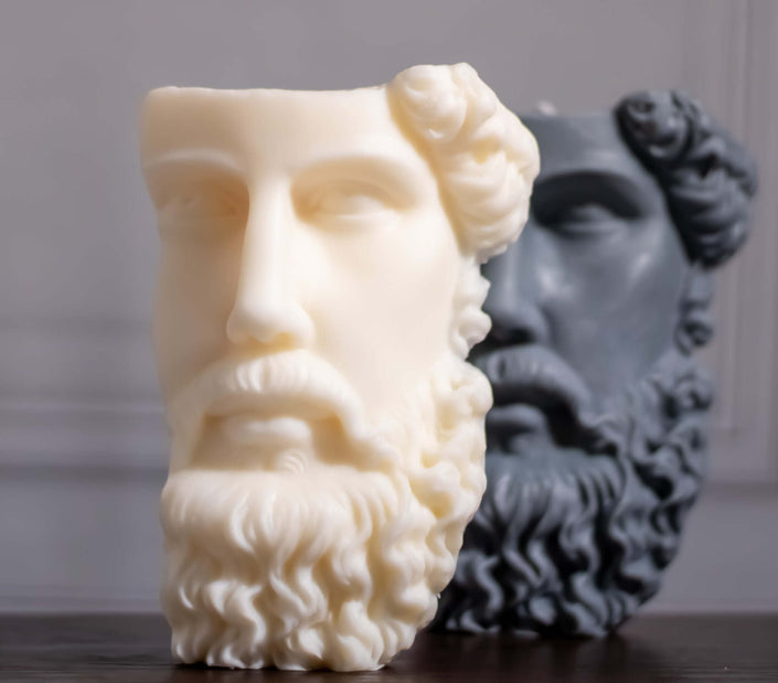 Sculptural soy wax candle in Greek face design, featuring one white and one gray candle bust, elegant home decor.