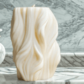 Sculptural wavy soy candle – minimalist handmade decor for modern calm interiors.