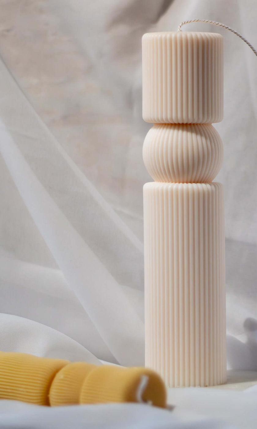 Tall and elegant pillar candle with a classic, kingly design, crafted from sustainable and non-toxic materials.