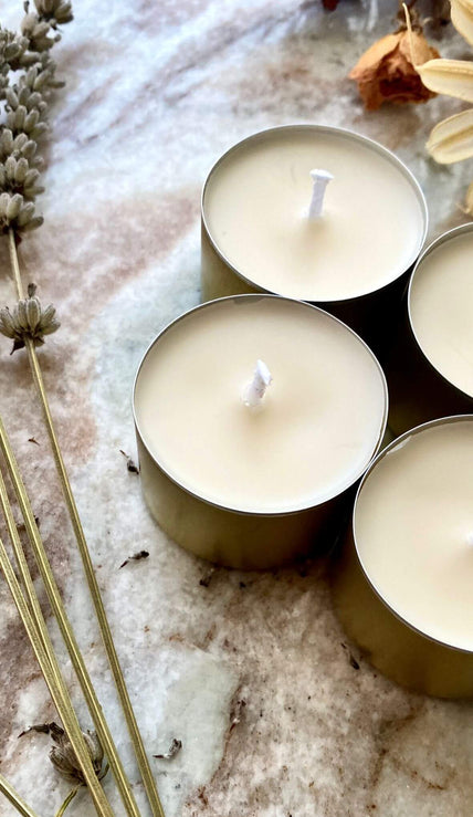 Set of natural soy wax tealight candles for sustainable lighting.
