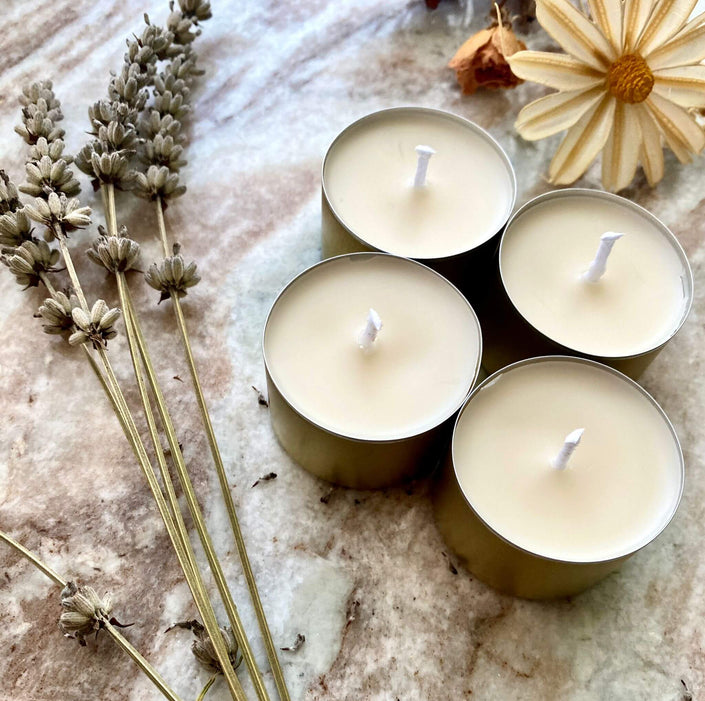 Set of natural soy wax tealight candles for sustainable lighting.