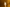 Small white mushroom candle on a reflective surface with a warm, blurred background